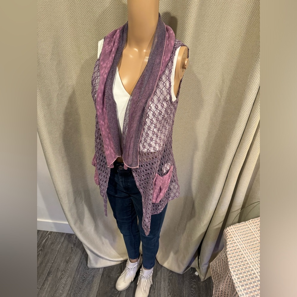 Really cute purple vest. Shrug